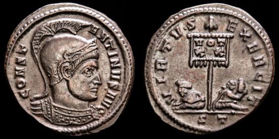 Ancient Coins - Constantine I (307-337 A.D.). Æ Follis. Ticinum. - VIRTVS EXERCIT, two captives at foot of standard inscribed VOT XX.